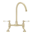 Astbury traditional bridge kitchen mixer tap with white ceramic levers deck mounted - brushed brass